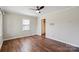 Bedroom featuring wood floors, a window, and closet with a ceiling fan at 503 N Boyce St, Gastonia, NC 28052