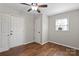 Cozy bedroom with wood flooring, a ceiling fan, and ample closet space, offering convenience at 503 N Boyce St, Gastonia, NC 28052