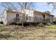 Beige ranch style house with large deck, backyard and blue front door at 503 N Boyce St, Gastonia, NC 28052