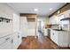 Modern kitchen with white cabinets, stainless steel appliances, and wood flooring at 503 N Boyce St, Gastonia, NC 28052