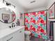 Clean bathroom with updated vanity, a patterned shower curtain, and neutral colors at 509 N Graham St # 1G, Charlotte, NC 28202