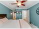 Bedroom with a view into the hallway, a ceiling fan, and an en suite bathroom at 509 N Graham St # 1G, Charlotte, NC 28202