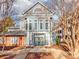 Two-story building exterior featuring a gray facade and landscaping at 509 N Graham St # 1G, Charlotte, NC 28202