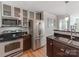 Modern kitchen with stainless steel appliances and dark wood cabinets at 509 N Graham St # 1G, Charlotte, NC 28202