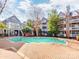 Inviting community pool area with brick pavers and lush landscaping at 509 N Graham St # 1G, Charlotte, NC 28202