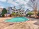 Inviting community pool surrounded by brick pavers at 509 N Graham St # 1G, Charlotte, NC 28202