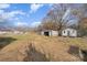 Large backyard with storage sheds and blue sky at 5204 Dellinger Cir, Cherryville, NC 28021