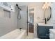 Modern bathroom featuring a tub with gray tile surround and updated vanity at 5204 Dellinger Cir, Cherryville, NC 28021