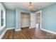 Bedroom with hardwood floors, closet, and view into another room at 5204 Dellinger Cir, Cherryville, NC 28021