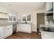 Modern kitchen with stainless steel appliances, light countertops, and ample natural light from the windows at 5204 Dellinger Cir, Cherryville, NC 28021