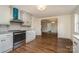 Modern kitchen with stainless steel appliances and open layout that flows to the dining area at 5204 Dellinger Cir, Cherryville, NC 28021