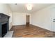 Well-lit living area with wood floors, neutral paint, and modern lighting at 5204 Dellinger Cir, Cherryville, NC 28021