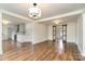 Bright living room showcasing hardwood floors, recessed lighting, and an open layout leading to the kitchen at 5204 Dellinger Cir, Cherryville, NC 28021