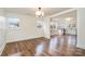 Open living and dining area with hardwood floors and neutral color palette at 5204 Dellinger Cir, Cherryville, NC 28021