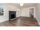 Spacious room with neutral walls, wood floors and a traditional fireplace at 5204 Dellinger Cir, Cherryville, NC 28021