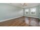 Bright bedroom with hardwood floors, ceiling fan, and ample natural light at 5204 Dellinger Cir, Cherryville, NC 28021