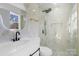 Modern bathroom with white vanity and glass shower at 5910 Grosner Pl, Charlotte, NC 28211