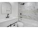 Modern bathroom with white vanity, bathtub, and marble shower at 5910 Grosner Pl, Charlotte, NC 28211