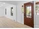 Bright entryway with hardwood floors and a wood door at 5910 Grosner Pl, Charlotte, NC 28211