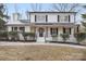 Stunning two-story home with white exterior and black accents at 5910 Grosner Pl, Charlotte, NC 28211