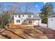 Rear view of charming two-story home with deck at 5910 Grosner Pl, Charlotte, NC 28211