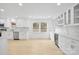 Modern kitchen with white cabinets and marble countertops at 5910 Grosner Pl, Charlotte, NC 28211