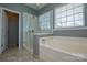 Bathroom with soaking tub and walk-in shower at 6132 Pale Moss Ln, Charlotte, NC 28269