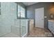 Large walk-in shower with marble tile at 6132 Pale Moss Ln, Charlotte, NC 28269