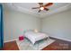 Bedroom with wood floors and ceiling fan at 6132 Pale Moss Ln, Charlotte, NC 28269