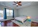 Bedroom with wood floors and access to deck at 6132 Pale Moss Ln, Charlotte, NC 28269