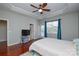 Primary bedroom with wood floors and en-suite bathroom at 6132 Pale Moss Ln, Charlotte, NC 28269