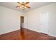 Bright bedroom featuring hardwood floors and ceiling fan at 6132 Pale Moss Ln, Charlotte, NC 28269