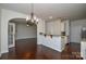 Kitchen with granite countertops, stainless steel appliances, and an island at 6132 Pale Moss Ln, Charlotte, NC 28269