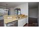 Kitchen features granite countertops and a double sink at 6132 Pale Moss Ln, Charlotte, NC 28269