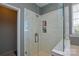 Large walk-in shower with marble tile and glass enclosure at 6132 Pale Moss Ln, Charlotte, NC 28269