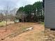 Partially cleared backyard with shed and trees at 7287 Gabriel St, Sherrills Ford, NC 28673