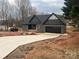 Front exterior view of a new home with gray siding and a driveway at 7287 Gabriel St, Sherrills Ford, NC 28673