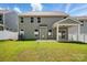 Backyard featuring a covered patio and green grass at 8230 Verona Rd # 80, Charlotte, NC 28213
