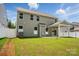 Backyard featuring a covered patio and green grass at 8230 Verona Rd # 80, Charlotte, NC 28213