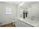 Bathroom featuring a double sink vanity, modern fixtures, a toilet, a window, and wood flooring at 8230 Verona Rd # 80, Charlotte, NC 28213