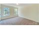 Charming bedroom with neutral carpeting and natural light at 8230 Verona Rd # 80, Charlotte, NC 28213