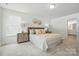 Inviting bedroom featuring soft bedding, decorative accents, and plenty of natural light at 8230 Verona Rd # 80, Charlotte, NC 28213