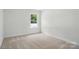 Neutral bedroom with carpet and a window at 8230 Verona Rd # 80, Charlotte, NC 28213
