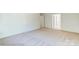 Simple bedroom with carpet and access to bathroom at 8230 Verona Rd # 80, Charlotte, NC 28213