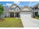 Charming two-story home with a two-car garage, a well-manicured lawn, and a welcoming front porch at 8230 Verona Rd # 80, Charlotte, NC 28213