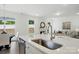 Bright, open kitchen area with stainless steel appliances and an island with a stainless steel sink at 8230 Verona Rd # 80, Charlotte, NC 28213