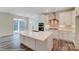 Open kitchen with white cabinets, large island, and stainless steel appliances at 8230 Verona Rd # 80, Charlotte, NC 28213