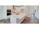 Modern kitchen with white cabinets, island, and stainless steel appliances at 8230 Verona Rd # 80, Charlotte, NC 28213