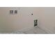 Convenient laundry area with tile flooring and built-in cabinets at 8230 Verona Rd # 80, Charlotte, NC 28213