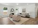 Bright living room with fireplace, hardwood floors, and neutral décor at 8230 Verona Rd # 80, Charlotte, NC 28213